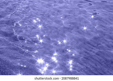 Abstract background of the sea waves with sunbeams on the surface.Trendy color of 2022. - Shutterstock ID 2087988841