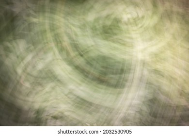 Abstract Background In Shades Of Green With Scuffs, Scratches And Blur. In The Photo, The Drawing Will Be Given A Slight Blame. Photo Effect.