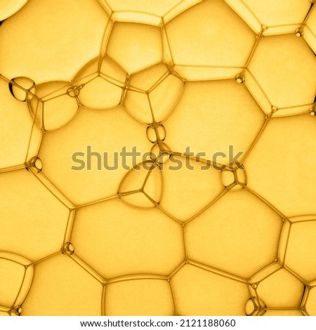 Abstract background of soap bubbles on yellow background