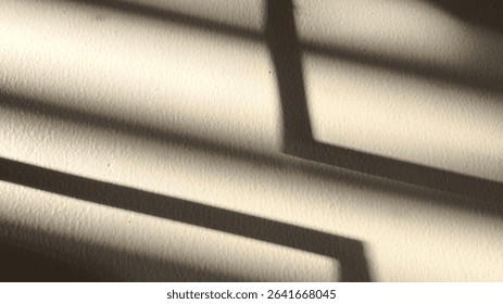Abstract background with soft window shadows falling on old textured wall. Ideal for vintage mood, artistic overlay, minimalist product mockup, or architectural design concept