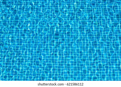 Abstract Background Of Sparkling Cool Blue Water In Swimming Pool