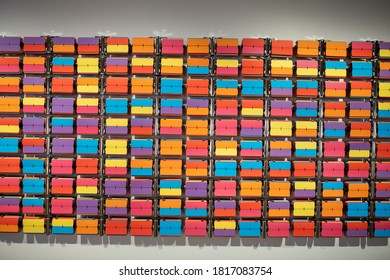 Abstract background with Split-flap Display Board Panel Font multi colored tiles.