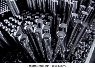 Abstract background of steel pipes stacked on a pallet - Shutterstock ID 1818338393
