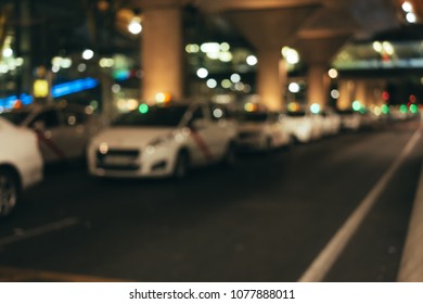 Abstract Background Of Taxi Blur Bokeh In Airport Parking Lot