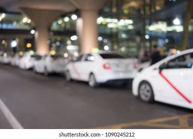 Abstract Background Of Taxi Blur Bokeh In Airport Parking Lot