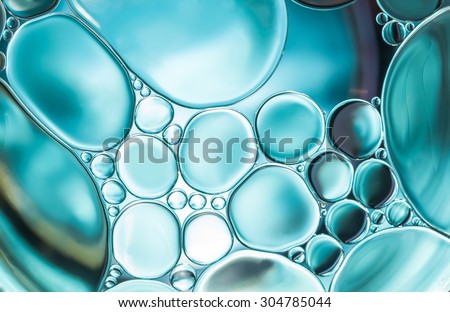 Abstract background and texture of blue bubbles with light illumination. The art of water surface for your products display and artwork design with copy space. Watery glare like jewelry so beautiful.
