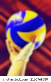 Abstract Background Texture Blur And Unfocused Image Of A Person's Hand Holding A Volleyball On The Volleyball Court