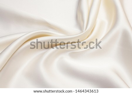 Abstract background texture of natural light color fabric. Fabric texture of natural cotton or linen, silk or satin, wool or jersey textile material. Luxurious white canvas background.