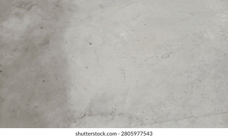 Abstract background texture of a plain gray polished concrete floor surface.