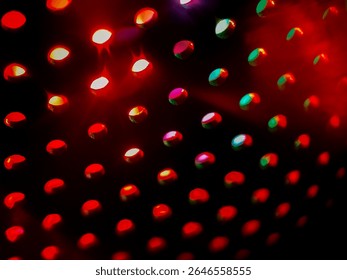 abstract background and textures, rows of circular lights sit against a dark background