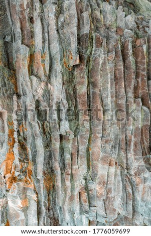 Abstract background from toned mountains texture, volcanic basalt as in Iceland. Bright colorful rock texture background for your design. Close-up