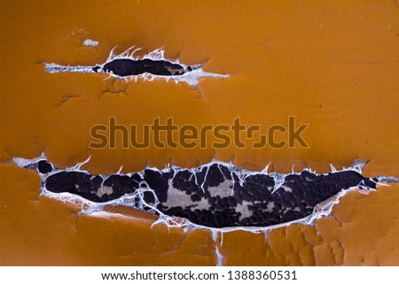 Abstract background of torn old leather sofa. Close up of lack old leather seat for pattern. 