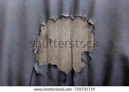 Abstract background of torn old leather sofa. Top view of ripped old leather seat background.