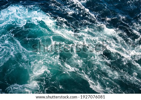 Abstract background. The waves of the sea water meet with underwater pointed rocks, forming whirlpools. Whirlpools in the area of the Norwegian city of Bod?. Norway