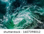 Abstract background. Waves of water of the river and the sea meet each other during high tide and low tide. Whirlpools of the maelstrom of Saltstraumen, Nordland, Norway