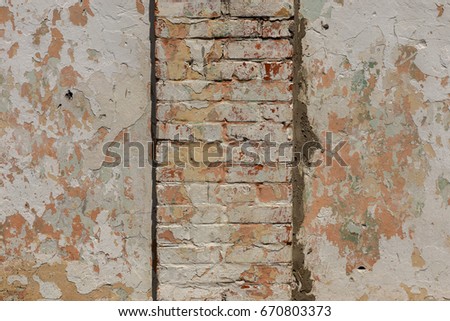 Similar – Background with plastered wall surface, bricks and wooden door