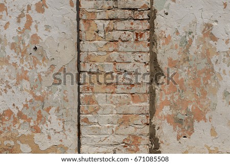 Similar – Background with plastered wall surface, bricks and wooden door