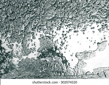 Abstract Background Of The Wet Concrete Ground. Color In Black And White