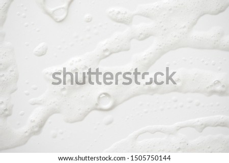 Abstract background white soapy foam texture. Shampoo foam with bubbles