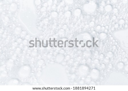 Abstract background white soapy foam texture. Shampoo foam with bubbles