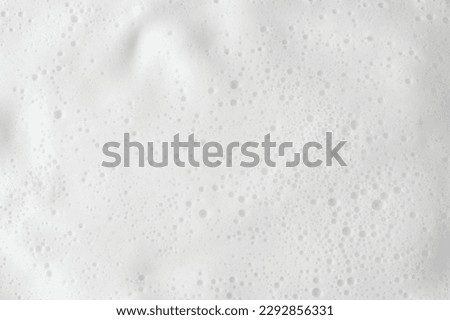 Abstract background white soapy foam texture. Shampoo foam with bubbles