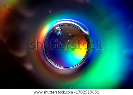 Abstract ball with spectrum colors and air bubbles. Colorful abstract circle with bubbles. Abstract sphere in rainbow vivid color background.