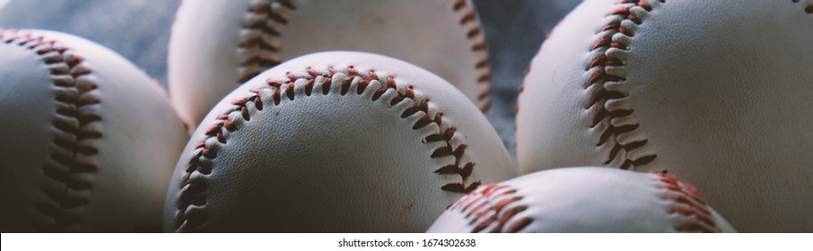 Abstract baseball banner with balls in shallow depth of field.