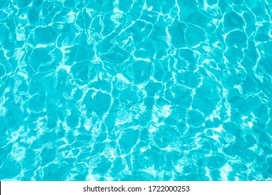 Abstract beautiful ripple wave   clear turquoise water surface in swimming pool  Turquoise blue water wave for background   abstract