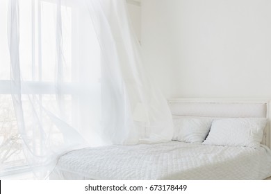 Abstract bedroom interior with window, white curtain and white bed