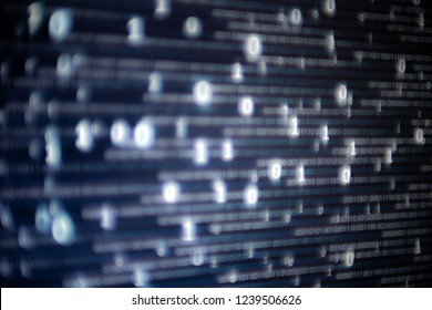 Abstract big data image. Computer display screen with binary code moving in the background. text moving in matrix code style from top moving downward to the bottom of the screen.