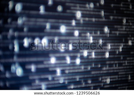 Abstract big data image. Computer display screen with binary code moving in the background. text moving in matrix code style from top moving downward to the bottom of the screen.