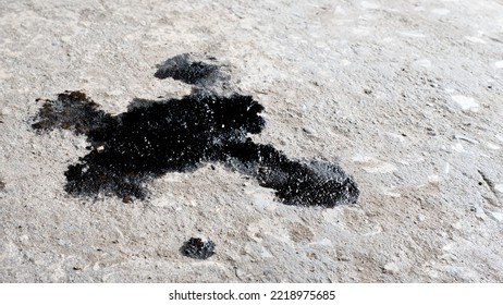 Abstract Black Engine Oil Drop On Concrete Floor Texture Backgruond.
Automobile Garage Dirty Old Oil Stain Cement Pattern.  