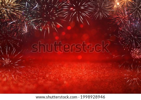 abstract black and gold glitter background with fireworks. christmas eve, 4th of july holiday concept
