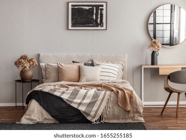 Abstract black oil painting in frame on empty beige wall of cozy bedroom - Powered by Shutterstock