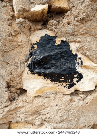 Abstract black paint grunge background made of stained old stonewall textured. Concrete decorative wallpaper background with copy space.