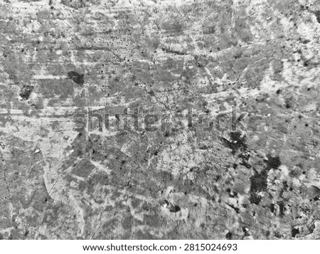 Abstract black scratched surface texture with subtle wear marks and fine random scratches. This high-resolution dark background features a rough, distressed appearance that creates a modern industrial and grunge aesthetic. The textured black surface is ideal for use as a backdrop in graphic design, website backgrounds, product presentations, posters, banners, packaging, advertising, and creative digital artwork. The natural imperfections and weathered details provide depth, character, and an authentic vintage feel while maintaining a minimalist monochrome style. Suitable for overlays, wallpaper, mockups, templates, social media graphics, branding materials, and artistic compositions. This versatile abstract texture can represent aged metal, painted concrete, worn plastic, stone, or industrial materials, making it perfect for both commercial and editorial design projects. The neutral dark tones allow text, logos, and design elements to stand out while adding visual interest without distraction. High-quality abstract background with realistic surface details, scratches, and distressed patterns for professional creative applications.