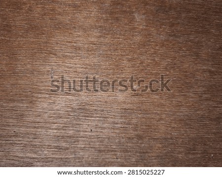Abstract black scratched surface texture with subtle wear marks and fine random scratches. This high-resolution dark background features a rough, distressed appearance that creates a modern industrial and grunge aesthetic. The textured black surface is ideal for use as a backdrop in graphic design, website backgrounds, product presentations, posters, banners, packaging, advertising, and creative digital artwork. The natural imperfections and weathered details provide depth, character, and an authentic vintage feel while maintaining a minimalist monochrome style. Suitable for overlays, wallpaper, mockups, templates, social media graphics, branding materials, and artistic compositions. This versatile abstract texture can represent aged metal, painted concrete, worn plastic, stone, or industrial materials, making it perfect for both commercial and editorial design projects. The neutral dark tones allow text, logos, and design elements to stand out while adding visual interest without distraction. High-quality abstract background with realistic surface details, scratches, and distressed patterns for professional creative applications.