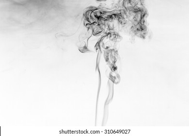 Abstract Black Smoke Swirls On White Background