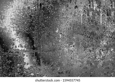 Abstract black and white aged grunge texture background, dark and light scratches, spotted metallic backdrop, rough gray stained surface, frosty glass pattern, grey dirty gloomy art design, copy space - Powered by Shutterstock