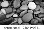 abstract black and white background with many round pebble stones