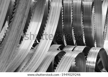 Abstract Black and white photography of many big Band saw blades