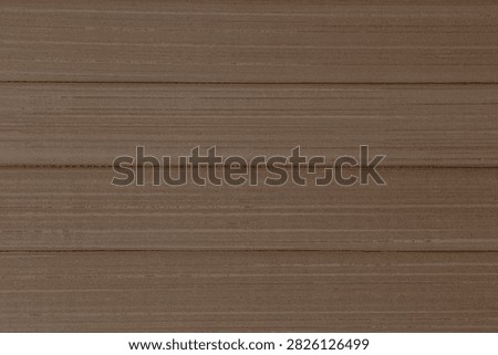 abstract blank cocoa brown backdrop: close up of bamboo mat made of horisontal planks