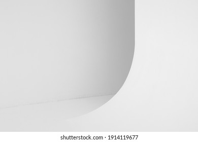 Abstract blank white photo studio interior background, cyclorama structure with a smooth transition between horizontal and vertical planes