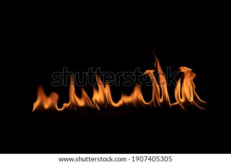 Abstract blaze fire flame texture for banner backgroundTexture of fire flames  on a black background. Real fiery bonfire for creative design elements.