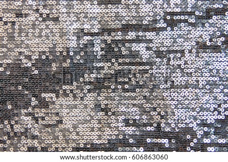 Abstract blinking background. Fabric texture with spangles