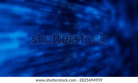 An abstract blue background featuring dynamic light streaks and soft bokeh effects, creating a sense of depth and movement.