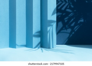 Abstract blue background with shadow of palm leaves for the presentation of a cosmetic product. A scene with a geometric backdrop. Podium for product promotion, beauty, natural eco cosmetic. Showcase. - Shutterstock ID 2179947105