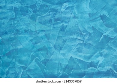 Abstract blue background.Venetian plaster in blue color, venetian stucco texture. Wall painted blue