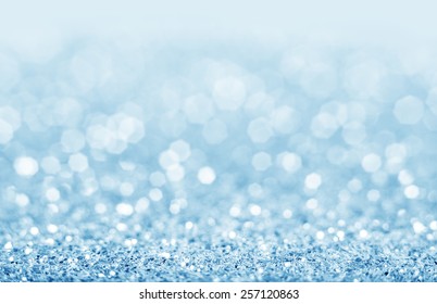 Abstract blue glitter background. Shiny glitter bokeh christmas background.