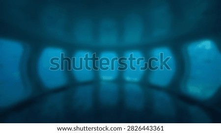 Abstract blue glowing lights create a bokeh effect in a dark tunnel, suggesting mystery and depth.